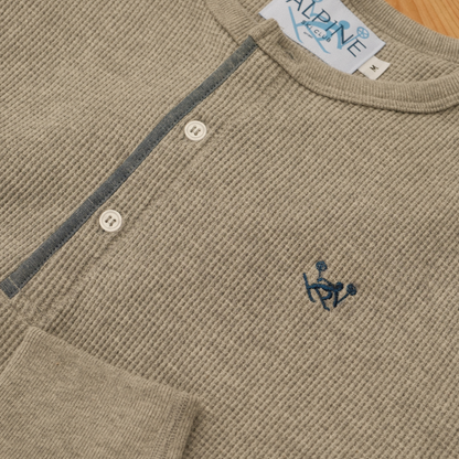 Light grey Alpine Ski Club long-sleeve Henley with waffle-knit texture, button placket and blue skier chest logo.